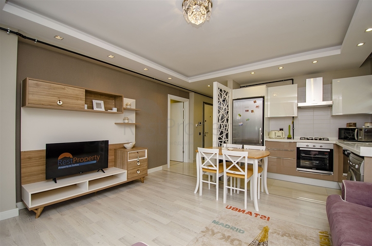 Двухкомнатная квартира с мебелью в элитном проекте в Коньяалты