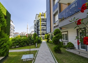 Двухкомнатная квартира с мебелью в элитном проекте в Коньяалты