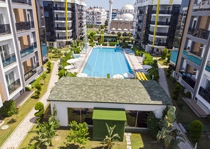 Двухкомнатная квартира с мебелью в элитном проекте в Коньяалты