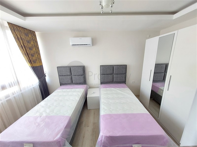 Двухэтажная квартира с мебелью в Махмутларе 