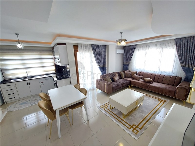 Двухэтажная квартира с мебелью в Махмутларе 