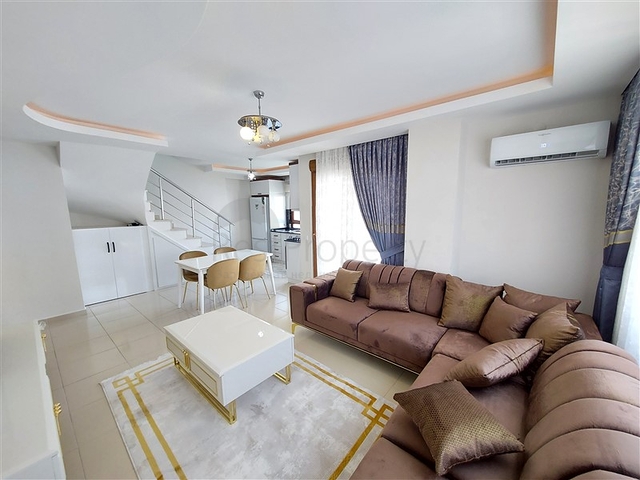 Двухэтажная квартира с мебелью в Махмутларе 