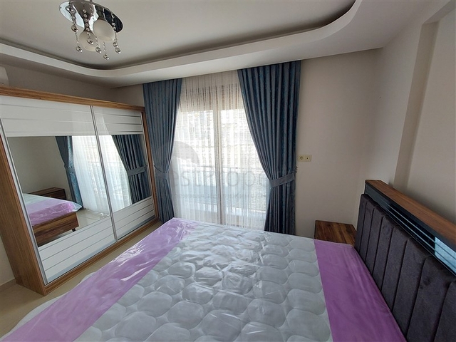 Двухэтажная квартира с мебелью в Махмутларе 