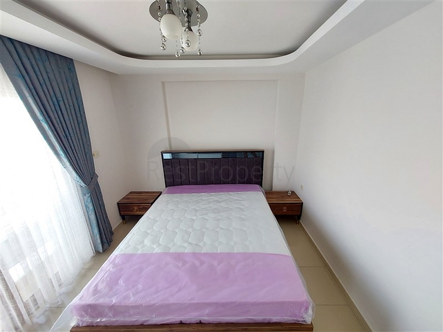 Двухэтажная квартира с мебелью в Махмутларе 