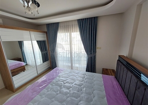 Двухэтажная квартира с мебелью в Махмутларе 