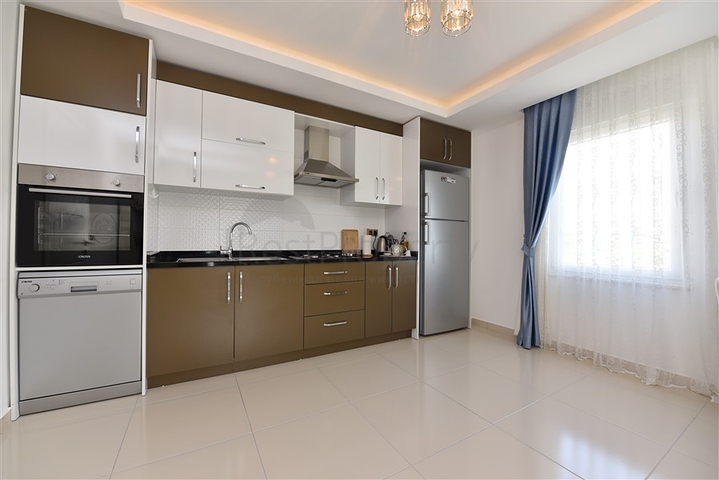 Двухкомнатная квартира в районе Махмутлар