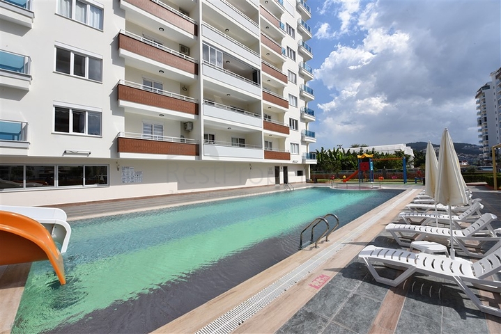 Двухкомнатная квартира в районе Махмутлар