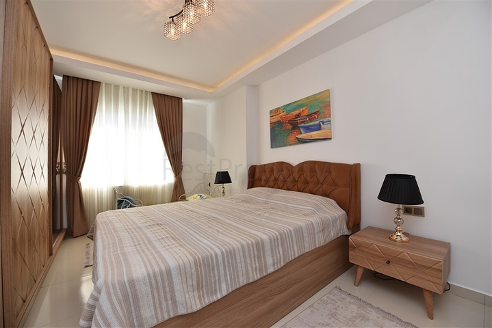 Двухкомнатная квартира в районе Махмутлар