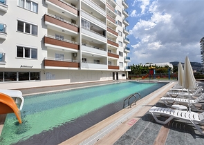 Двухкомнатная квартира в районе Махмутлар