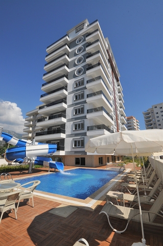 Квартира планировкой 2+1 в новом доме в Махмутларе