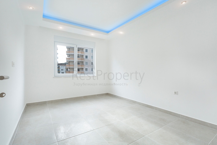 Квартира планировкой 2+1 в новом доме в Махмутларе