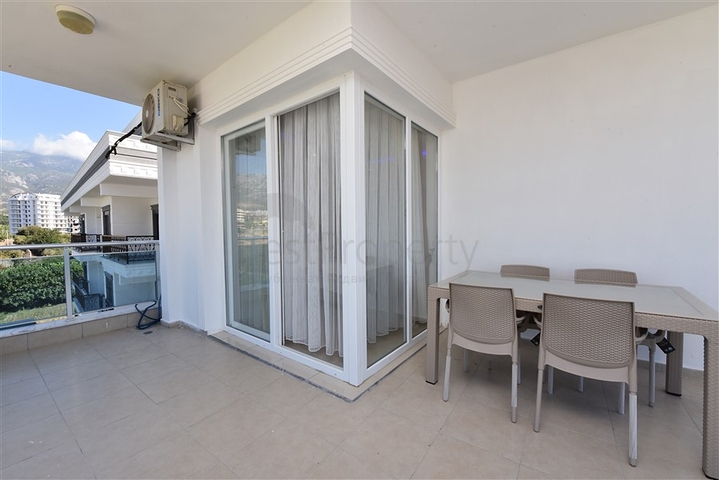 Просторная двухкомнатная квартира в Махмутларе