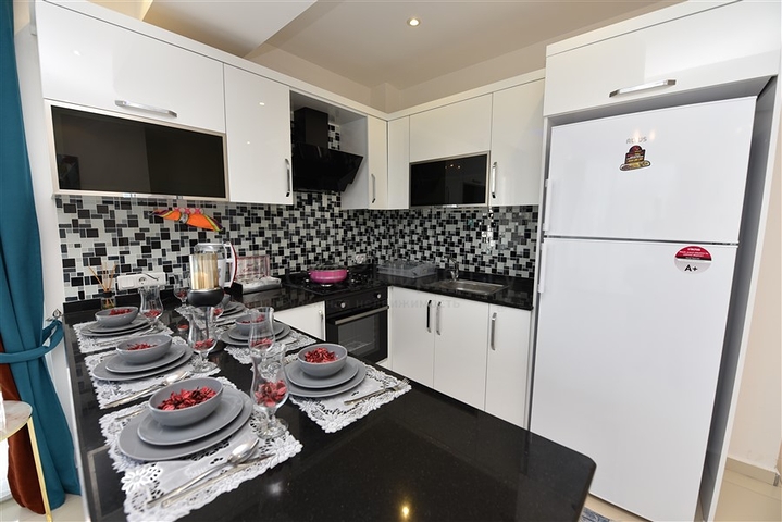 Просторная двухкомнатная квартира в Махмутларе