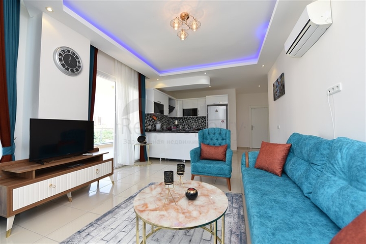 Просторная двухкомнатная квартира в Махмутларе