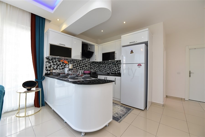 Просторная двухкомнатная квартира в Махмутларе