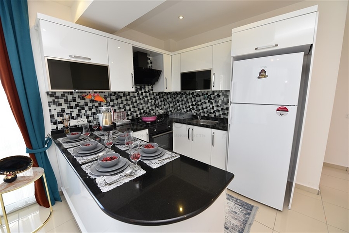 Просторная двухкомнатная квартира в Махмутларе