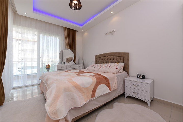 Просторная двухкомнатная квартира в Махмутларе