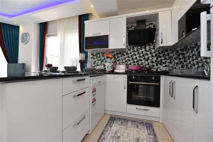 Просторная двухкомнатная квартира в Махмутларе