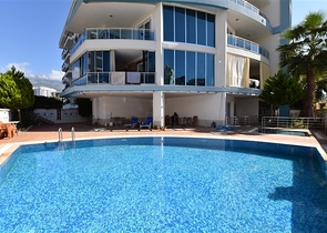 Просторная двухкомнатная квартира в Махмутларе