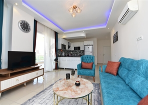 Просторная двухкомнатная квартира в Махмутларе