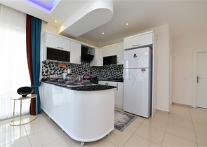 Просторная двухкомнатная квартира в Махмутларе