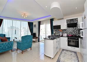 Просторная двухкомнатная квартира в Махмутларе