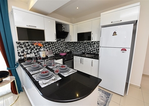 Просторная двухкомнатная квартира в Махмутларе