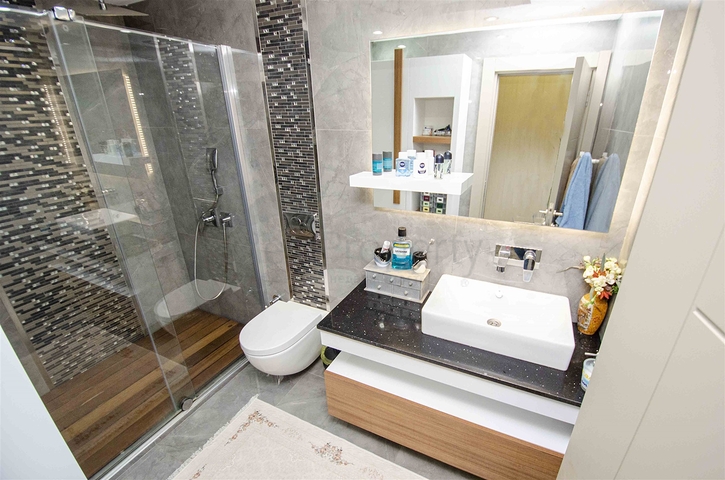 Элитная квартира 5+1 с выходом в сад в Унжалы Коньяалты