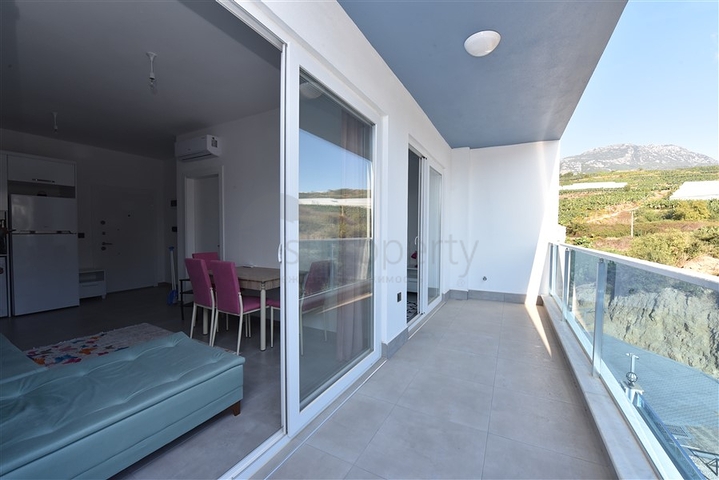 Двухкомнатная квартира в Махмутларе по выгодной цене