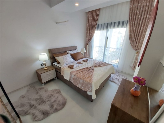 Двухкомнатная абсолютно новая квартира в Махмутларе