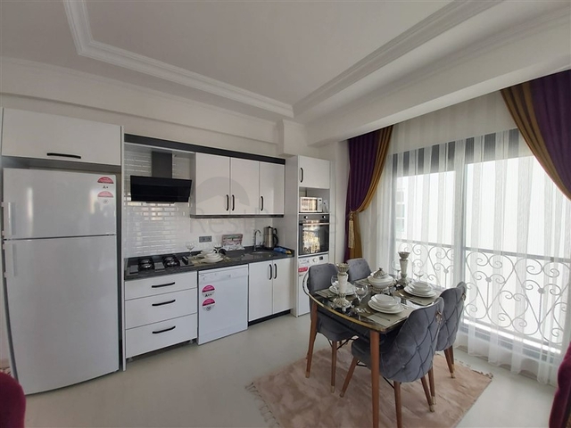 Двухкомнатная абсолютно новая квартира в Махмутларе