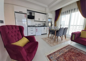 Двухкомнатная абсолютно новая квартира в Махмутларе