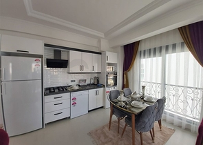 Двухкомнатная абсолютно новая квартира в Махмутларе