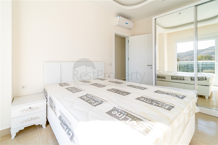 Просторная двухкомнатная квартира в районе Махмутлар