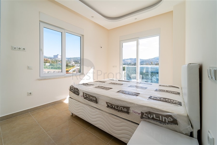 Просторная двухкомнатная квартира в районе Махмутлар