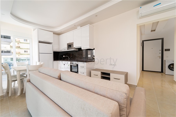 Просторная двухкомнатная квартира в районе Махмутлар