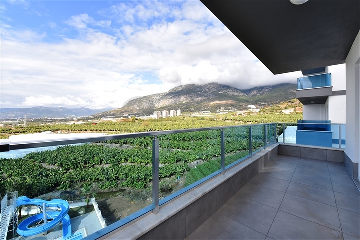 Двухкомнатная меблированная квартира в новом комплексе района Махмутлар