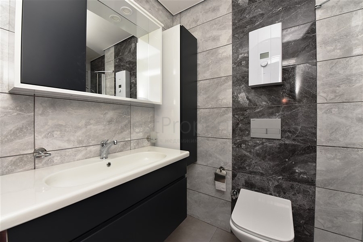 Двухкомнатная меблированная квартира в новом комплексе района Махмутлар