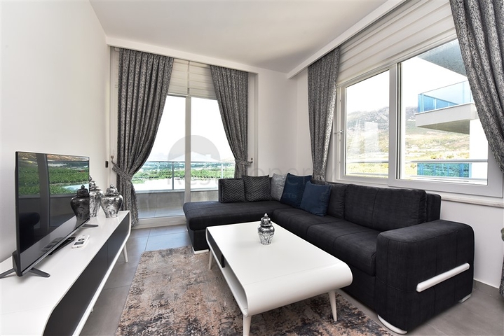 Двухкомнатная меблированная квартира в новом комплексе района Махмутлар