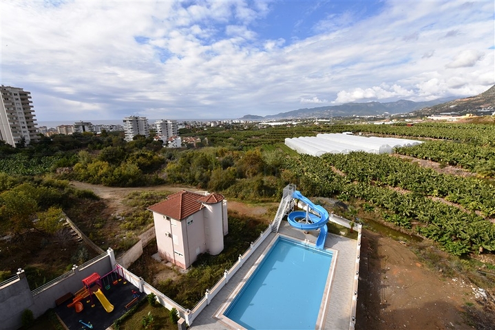 Двухкомнатная меблированная квартира в новом комплексе района Махмутлар