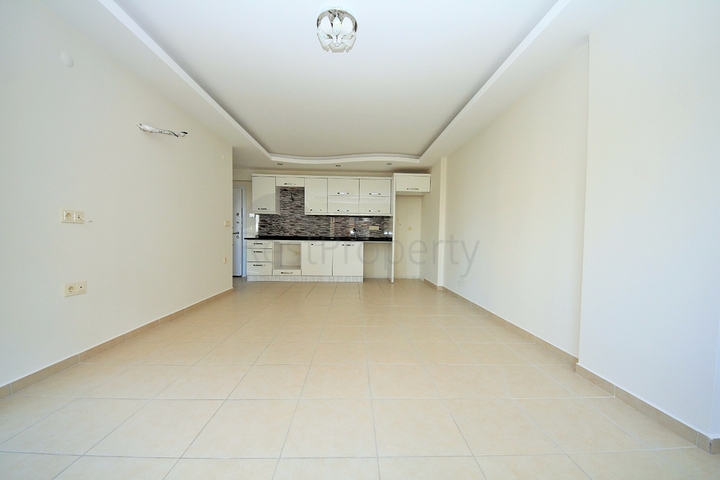 Двухкомнатная квартира в районе Махмутлар