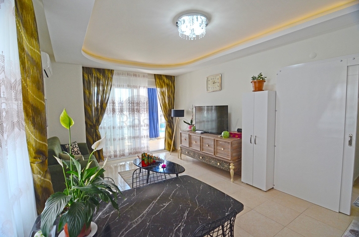 Двухкомнатная квартира в районе Махмутлар