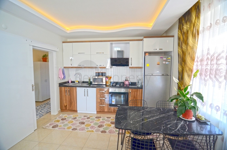 Двухкомнатная квартира в районе Махмутлар