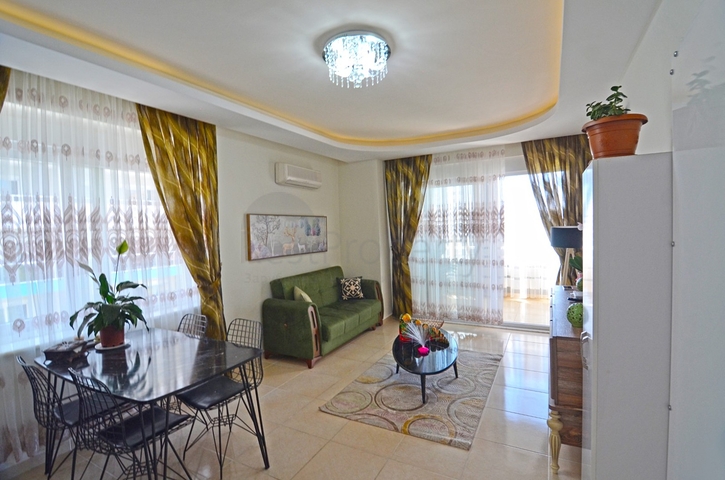 Двухкомнатная квартира в районе Махмутлар