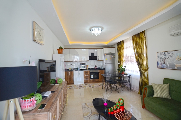 Двухкомнатная квартира в районе Махмутлар