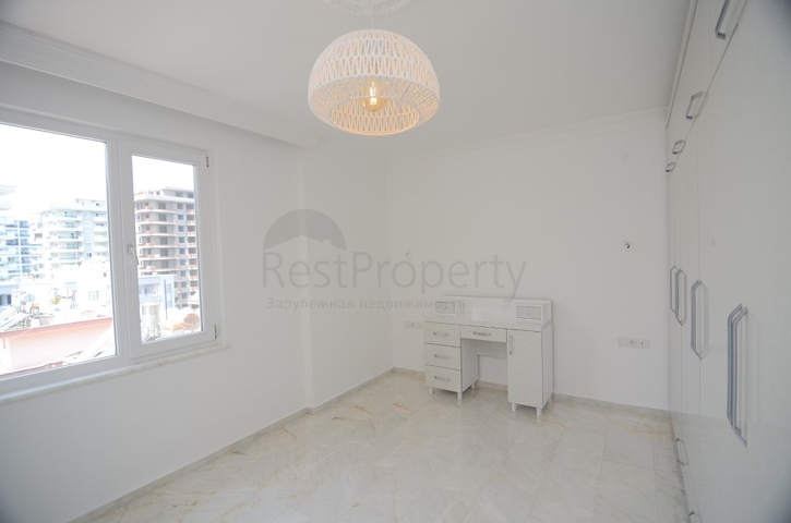 Трехкомнатная квартира в районе Махмутлар