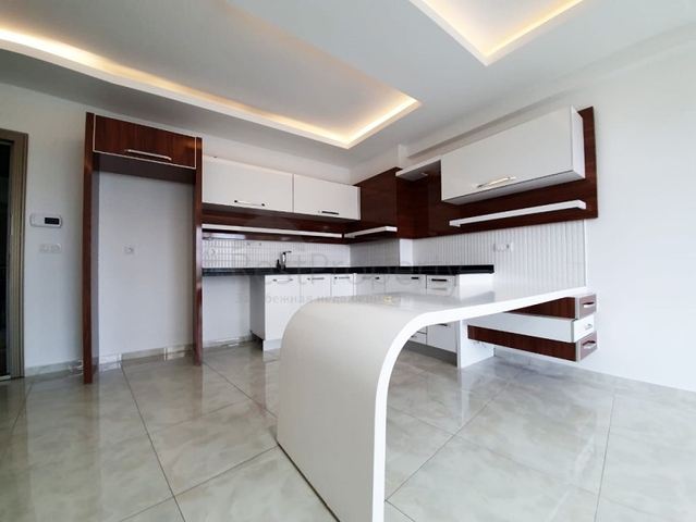 Двухкомнатная квартира в районе Махмутлар