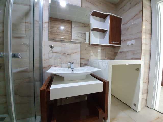 Двухкомнатная квартира в районе Махмутлар