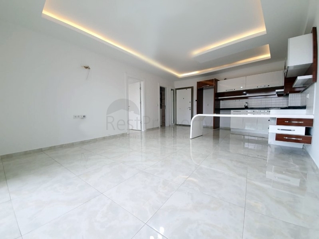 Двухкомнатная квартира в районе Махмутлар