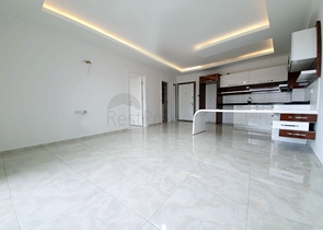 Двухкомнатная квартира в районе Махмутлар